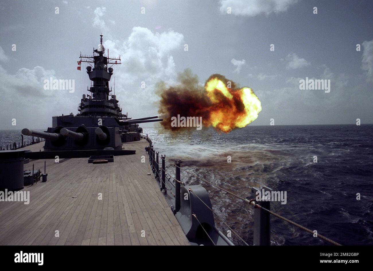 The battleship USS IOWA (BB61) fires a round from its No. 2 Mark 7 16inch/50caliber gun