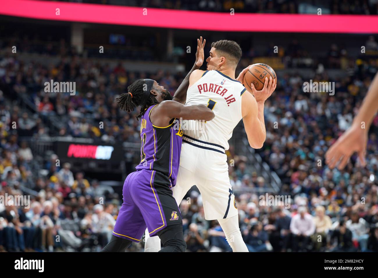 Los Angeles Lakers guard Patrick Beverley (21) covers Denver Nuggets