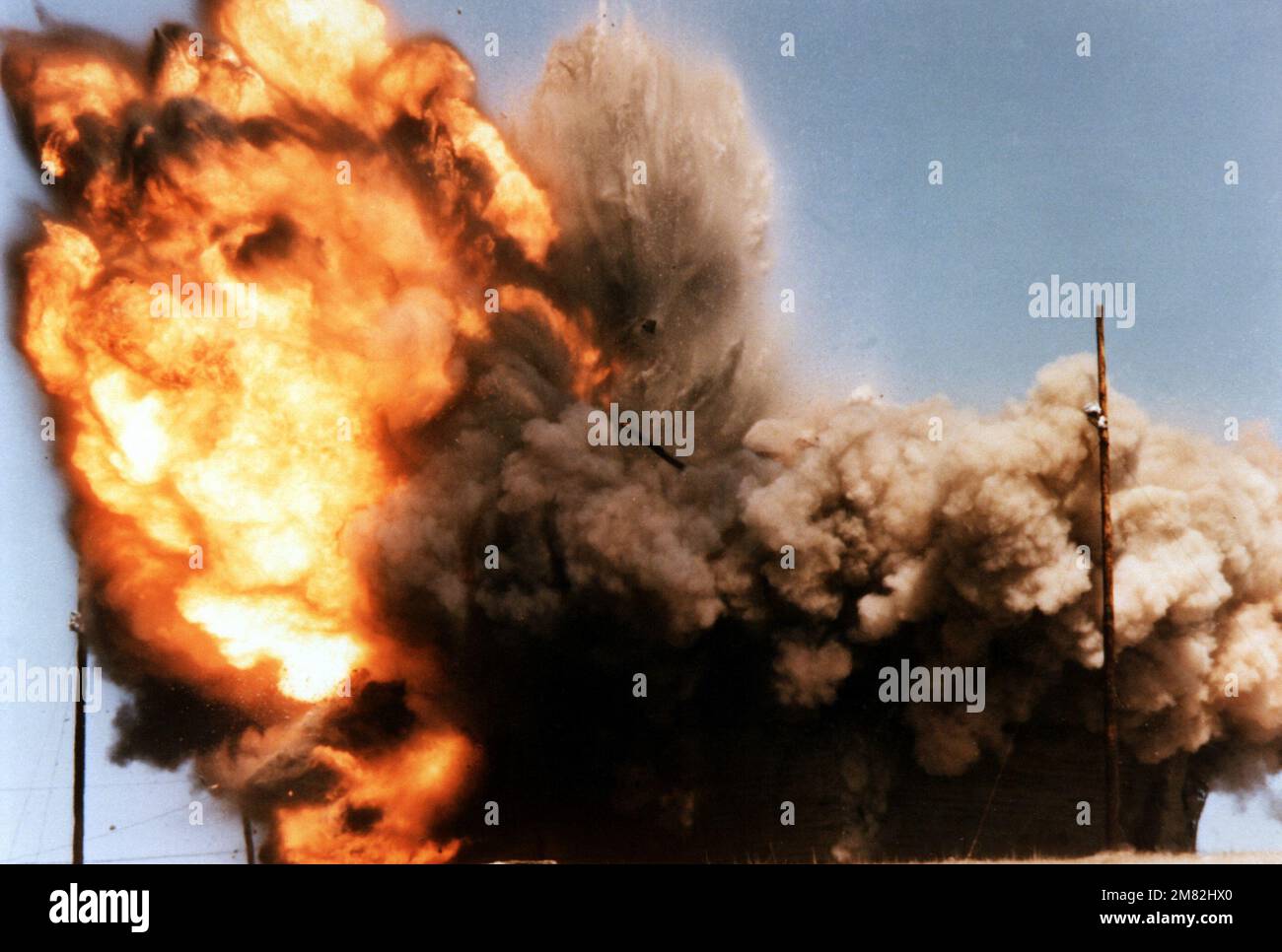 A concrete target explodes after being struck by a conventionally armed