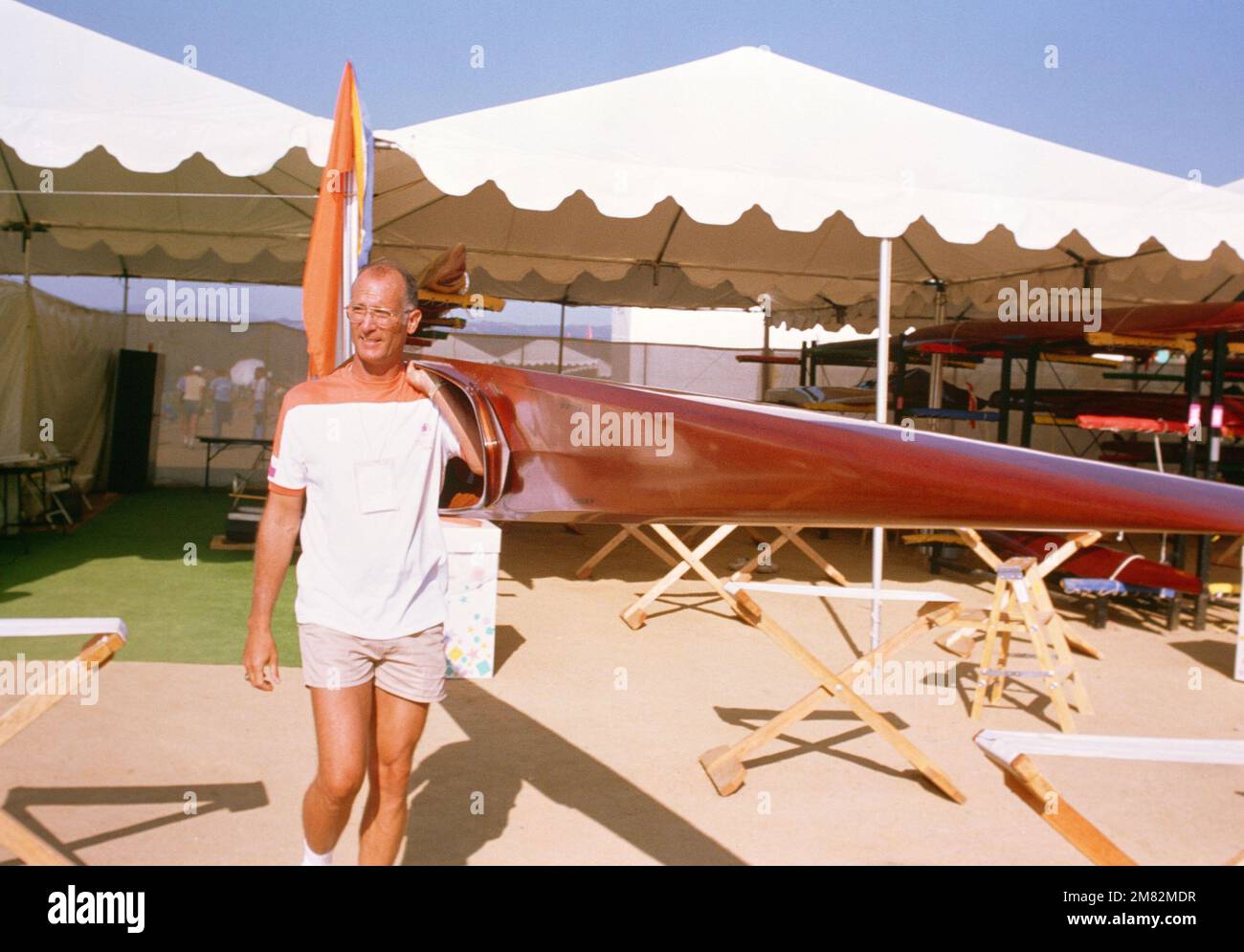 Army Lieutenant Colonel Paul J. Beachem from Fort Sheriden, III., a canoeing official carries a kayak during competition at the 1984 Summer Olympics. Lieutenant Colonel Beachem in the 1960 and 1968 Olympics. Base: Lake Casitas State: California (CA) Country: United States Of America (USA) Stock Photo