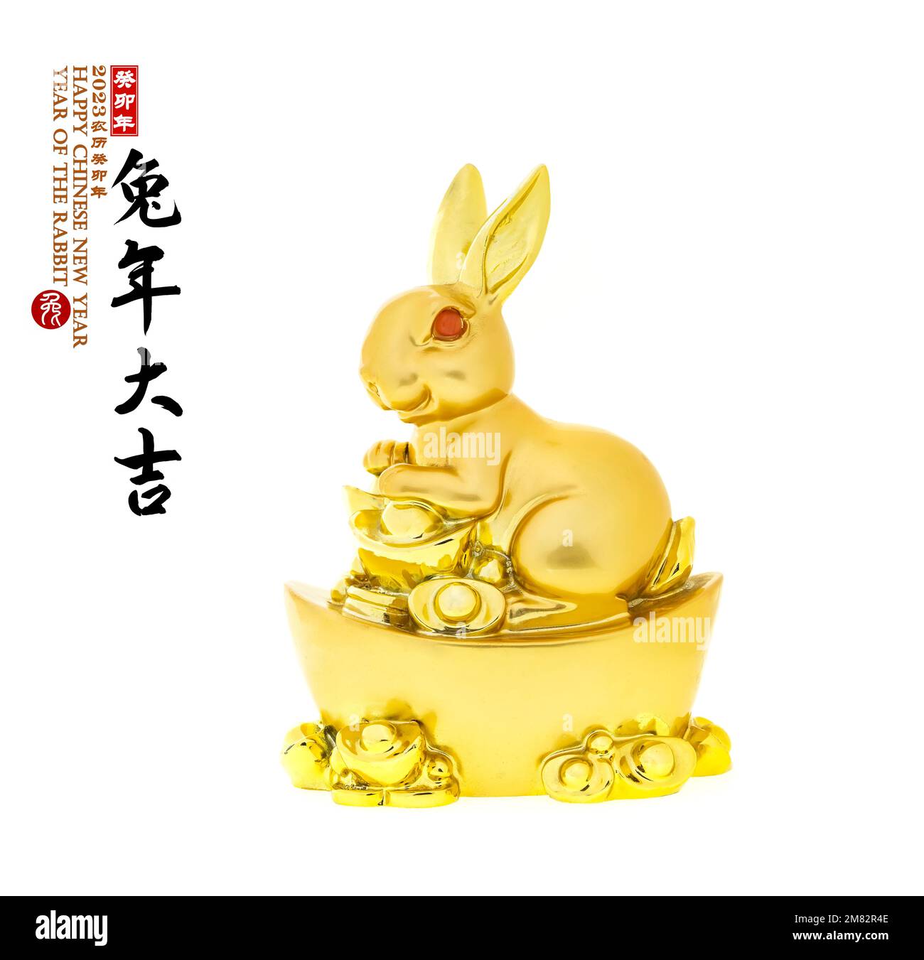 Tradition Chinese golden rabbit statue,,Chinese characters translation: "good luck for year of the rabbit".leftside word and seal mean:Chinese calenda Stock Photo