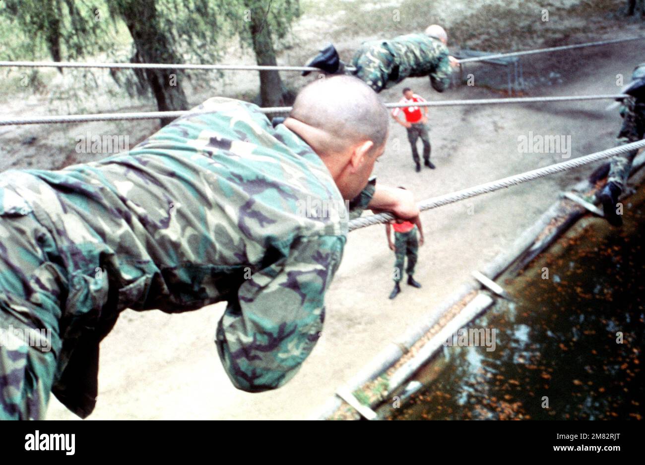 O Course Confidence Course Rope Recruits pull themselves across a rope bridge on the confidence course ...