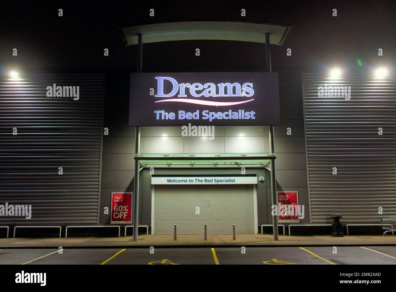 Dreams the bed specialist shop sign above front entrance at night with no people Clyde Retail Park, Livingston Street, Clydebank Stock Photo