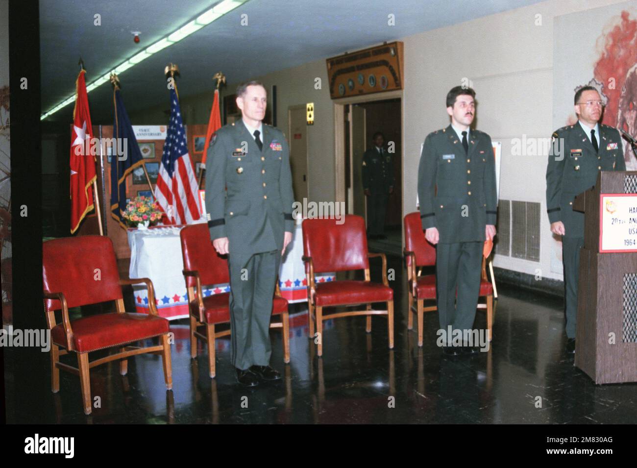 Guests stand at attention during the 20th anniversary celebration of ...