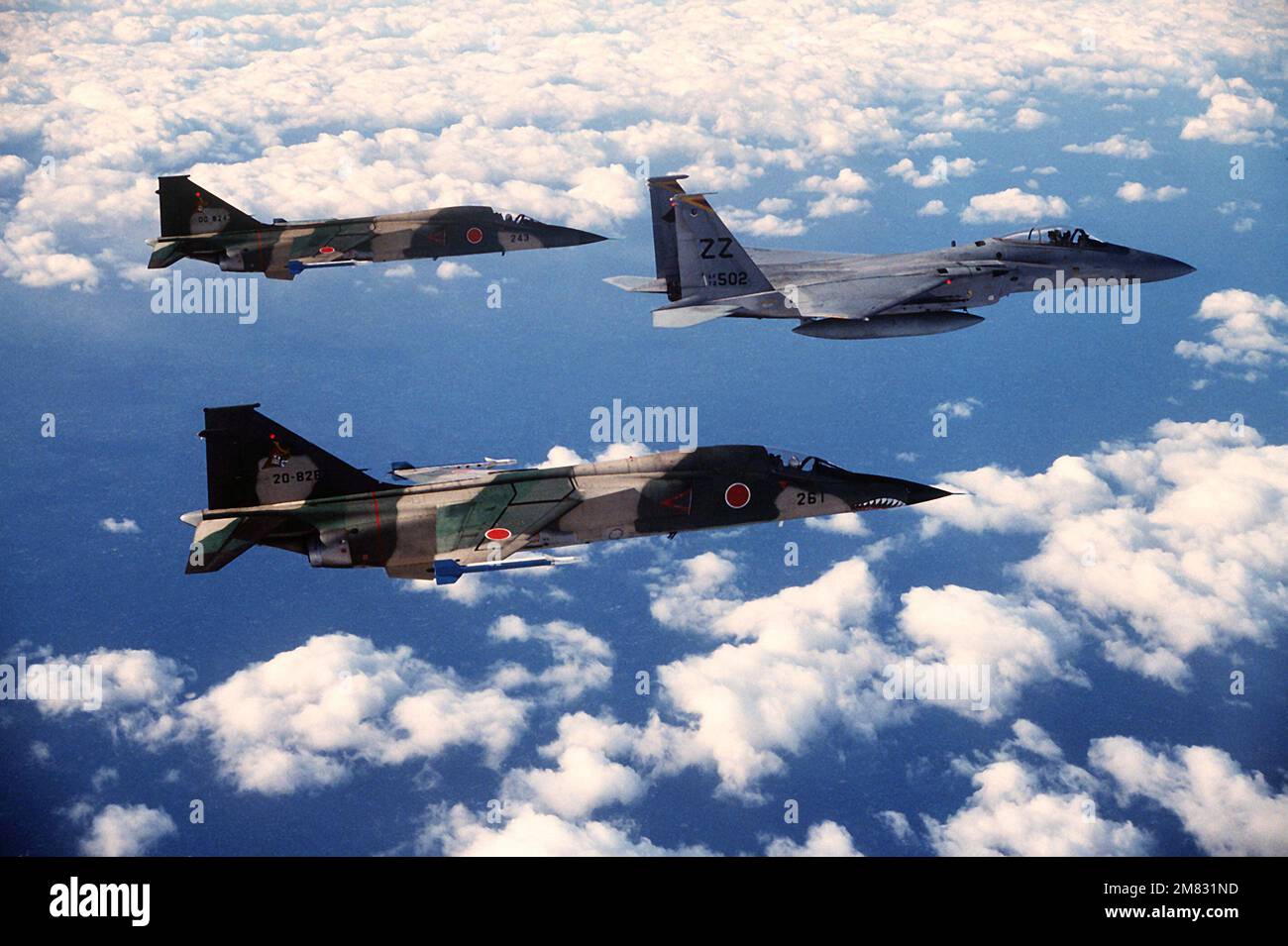 An air-to-air right side view of a 12th Tactical Fighter Squadron F-15 ...