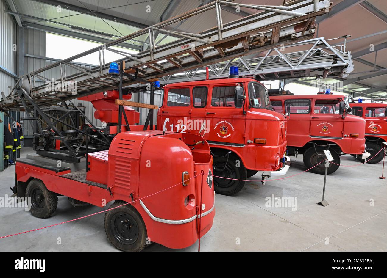 Welzow, Germany. 11th Jan, 2023. Many fire engines stand in an exhibition hall of the fire department museum Welzow e.V. The Welzow Fire Department Park houses one of the largest fire department history collections in Germany. In addition to historic fire engines, equipment and uniforms, all kinds of unique equipment can be admired here, including even a firefighting tank. The museum is always open on weekends from April to October. Credit: Patrick Pleul/dpa/Alamy Live News Stock Photo