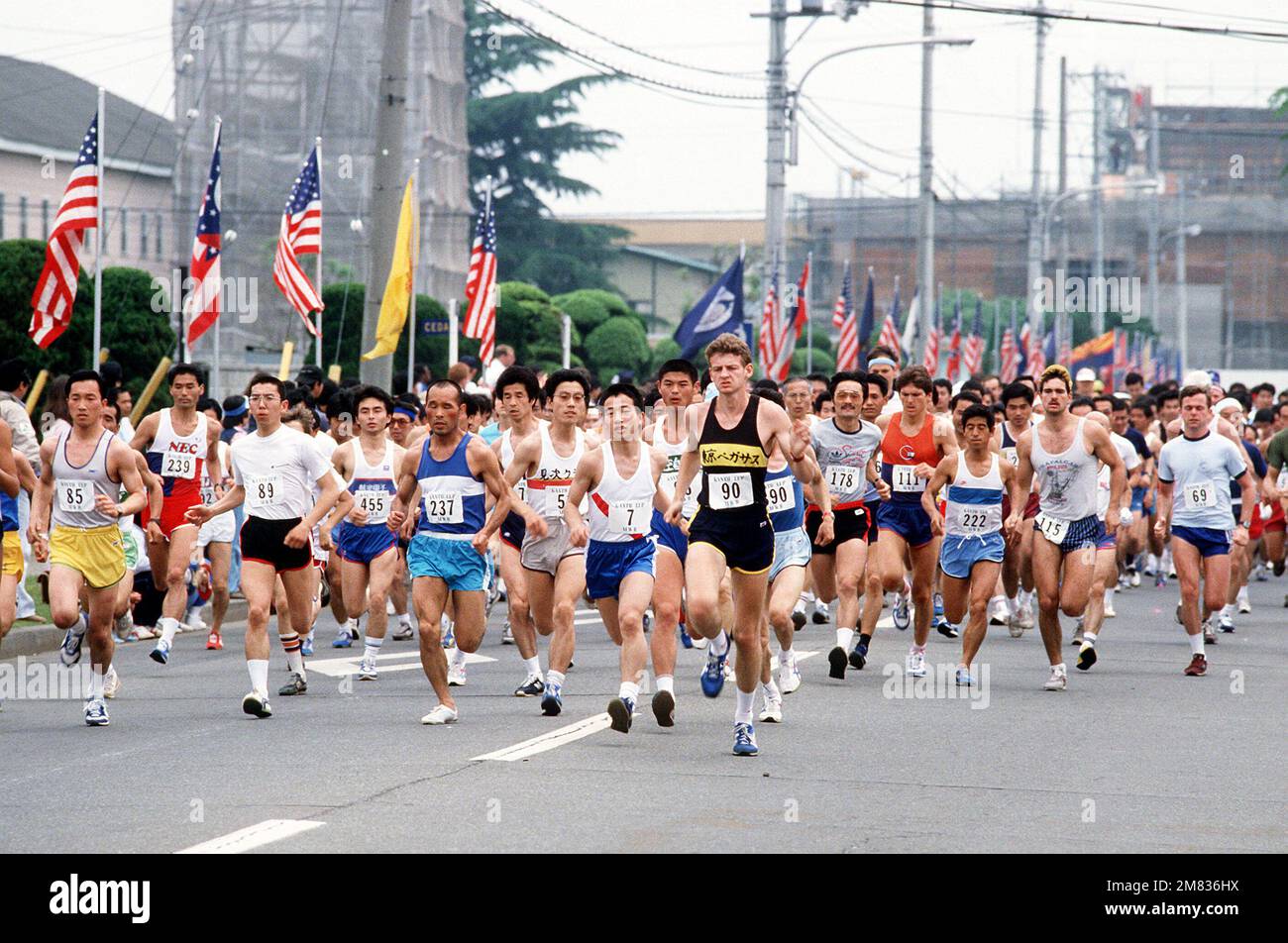 Japanese and American runners from the Kanto plain area participate in the 'Yokota Fun Run'. Over 2000 contestants in different kilometer races, sponsored by the Morale, Welfare and Recreation Division. The competition course traversed the base, allowing the participants and their guests to share a day of intercultural experience. Base: Yokota Air Base Country: Japan (JPN) Stock Photo