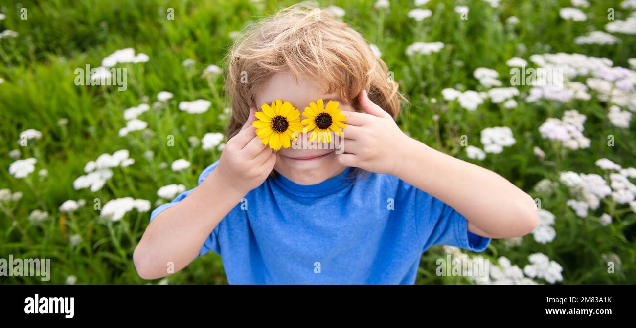 Close up portrait of cute child outdoors. Spring banner for website ...