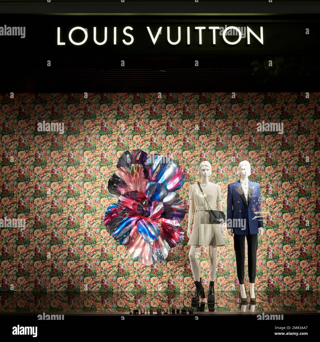 Shop window of luxury goods company Louis Vuitton in a popular shopping street in Berlin at night Stock Photo