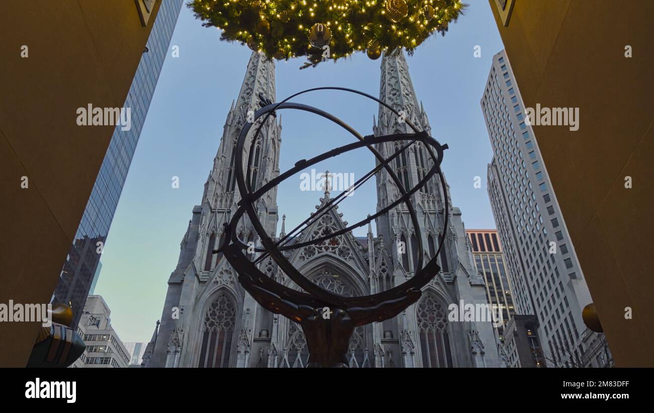 The famous Atlas Statue against the St Patricks Cathedral in New York City, USA Stock Photo