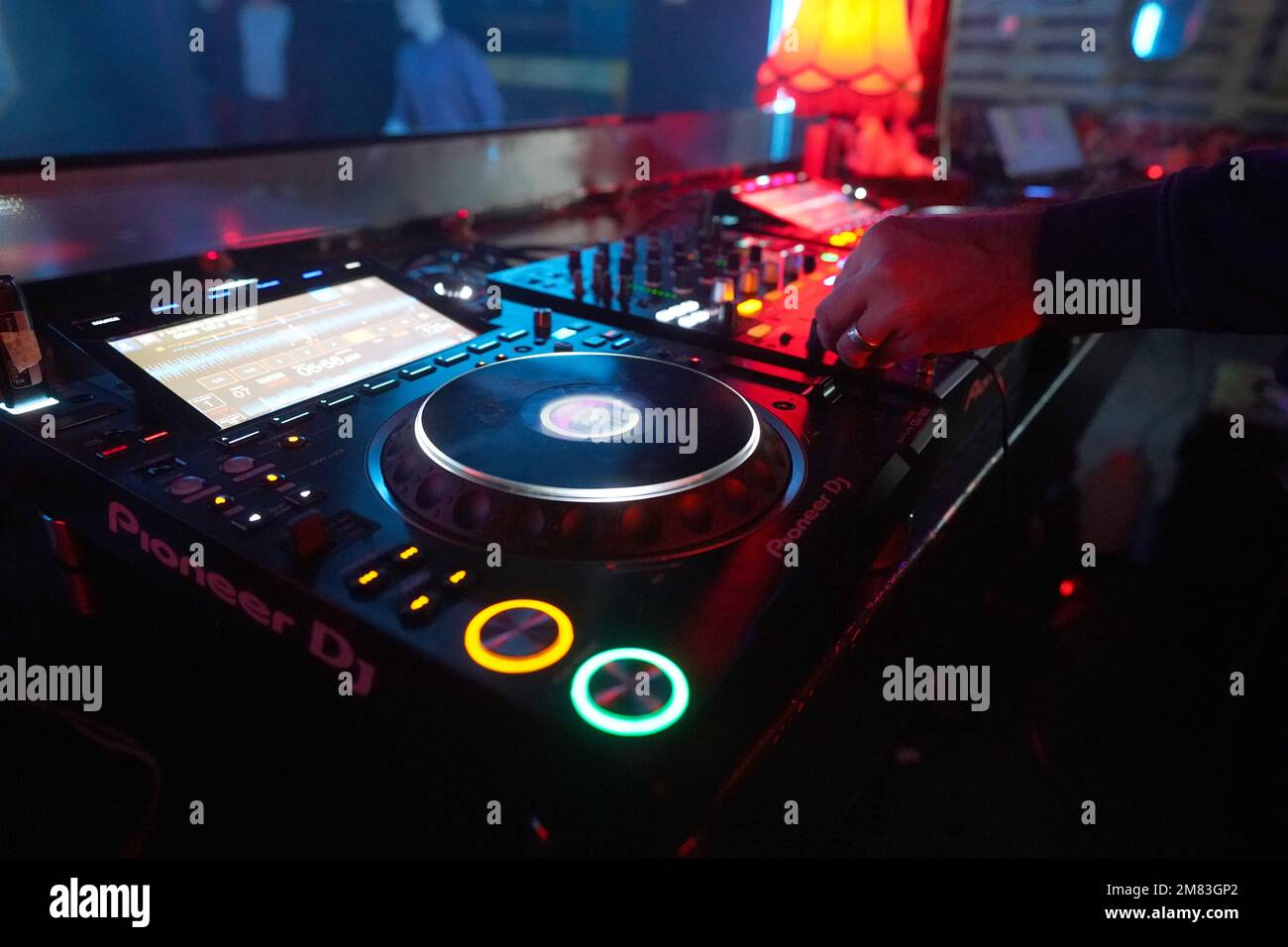 Hamburg, Germany. 05th Jan, 2023. A DJ plays massive techno beats during the weekly event 'Topspin Techno' at the Solar Club in Baalsaal on the Reeperbahn. Techno, table tennis, Topspin - what started as an idea for one or two events has now become almost a must-do event on Thursdays in Hamburg's techno scene. If you're in the mood for a round of table tennis and sets by Hamburg DJs, Topspin is definitely the place to be. (to dpa 'Topspin Techno - Table tennis in the scene club') Credit: Marcus Brandt/dpa/Alamy Live News Stock Photo