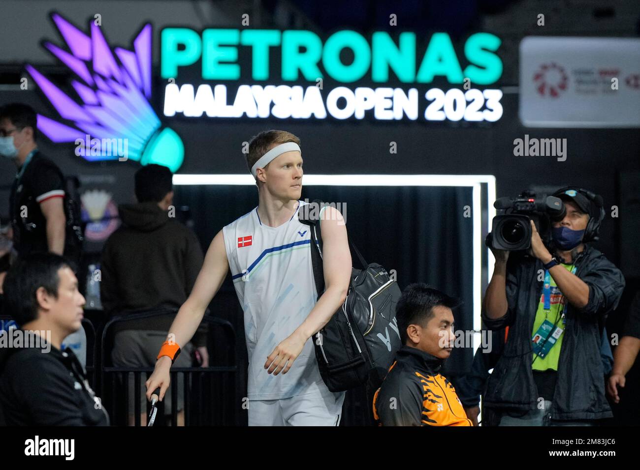 Denmark's Anders Antonsen walks into the court for men's singles match