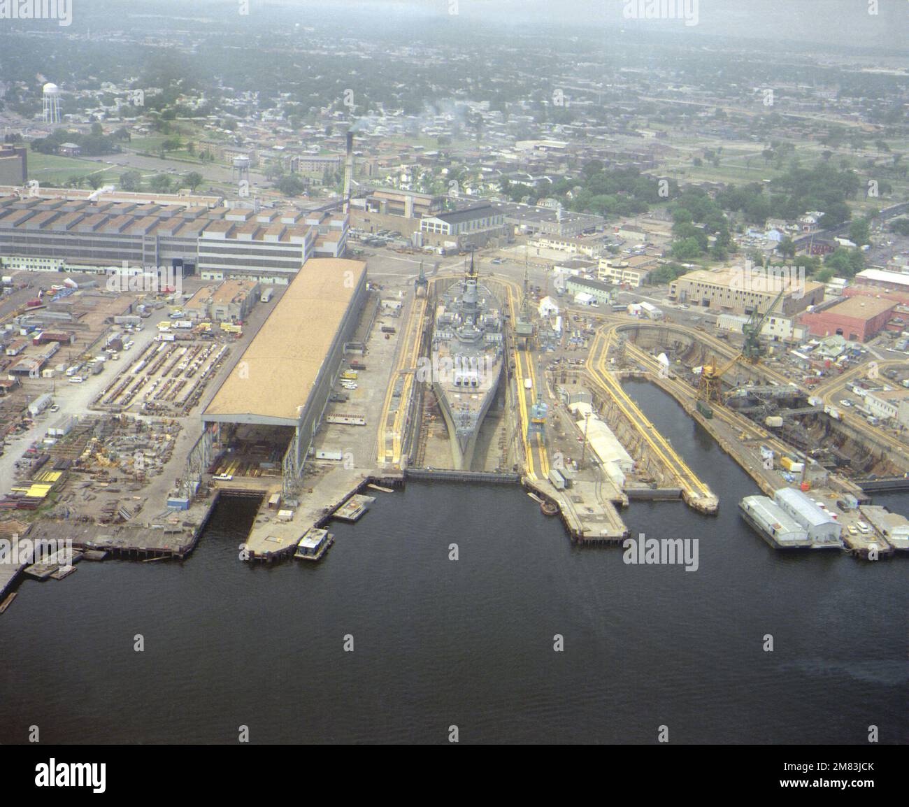 An aerial view of the battleship USS IOWA (BB61) in dry dock No. 4 at