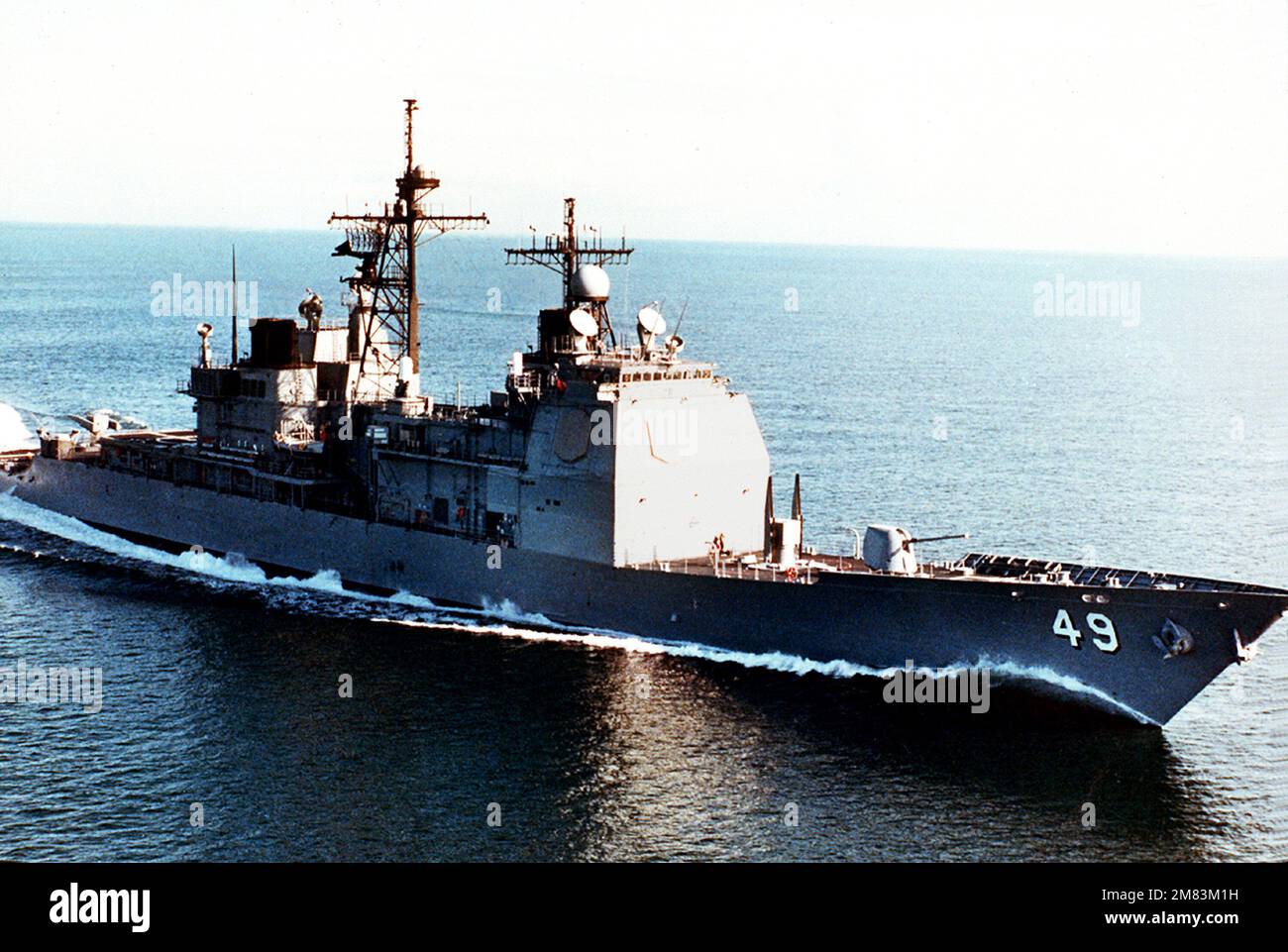 An aerial starboard bow view of the Ticonderoga Class Aegis guided missile cruiser VINCENNES (CG-49) underway during at-sea testing prior to its commissioning on July 6, 1985. Country: Unknown Stock Photo