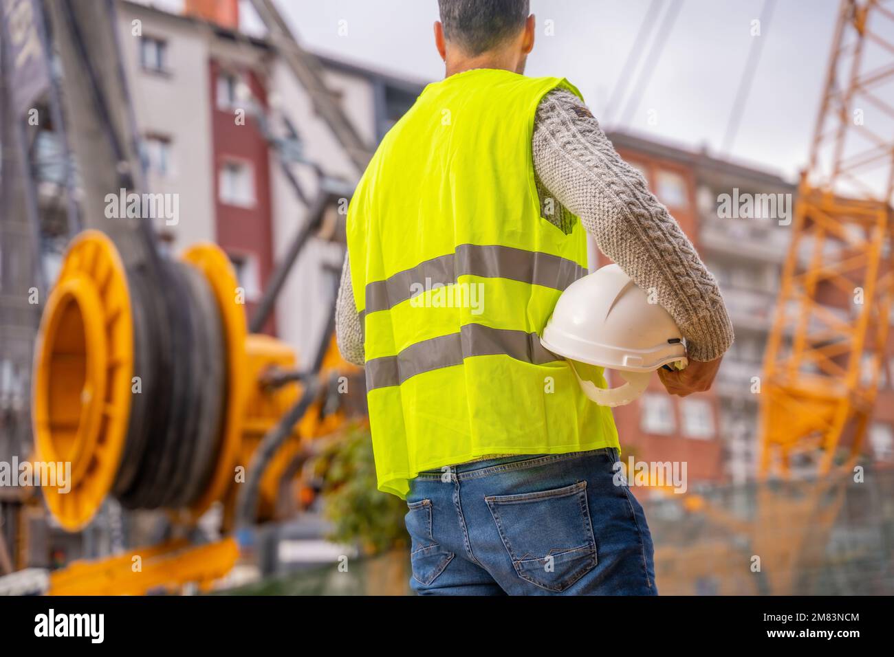 Engineer working blueprint construction helmet hi-res stock photography ...