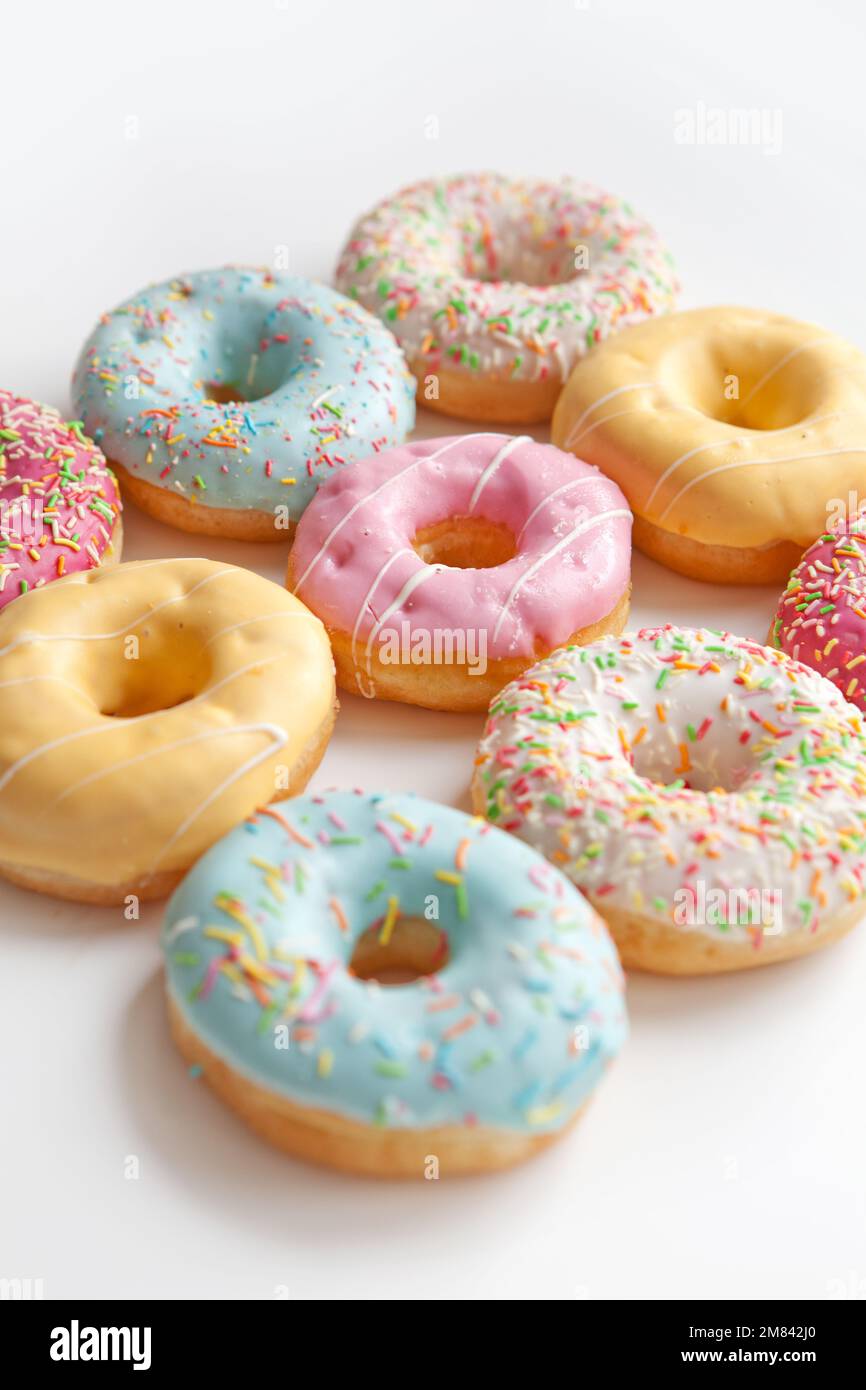 Colorful delicious donuts isolated on white background Stock Photo - Alamy