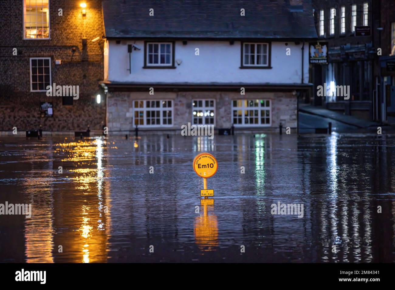 A York City council parking sign is submerged in flood water as heavy ...
