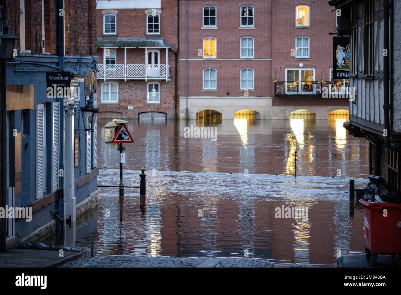 Local business are flooded as heavy rain causes the River Ouse in York ...