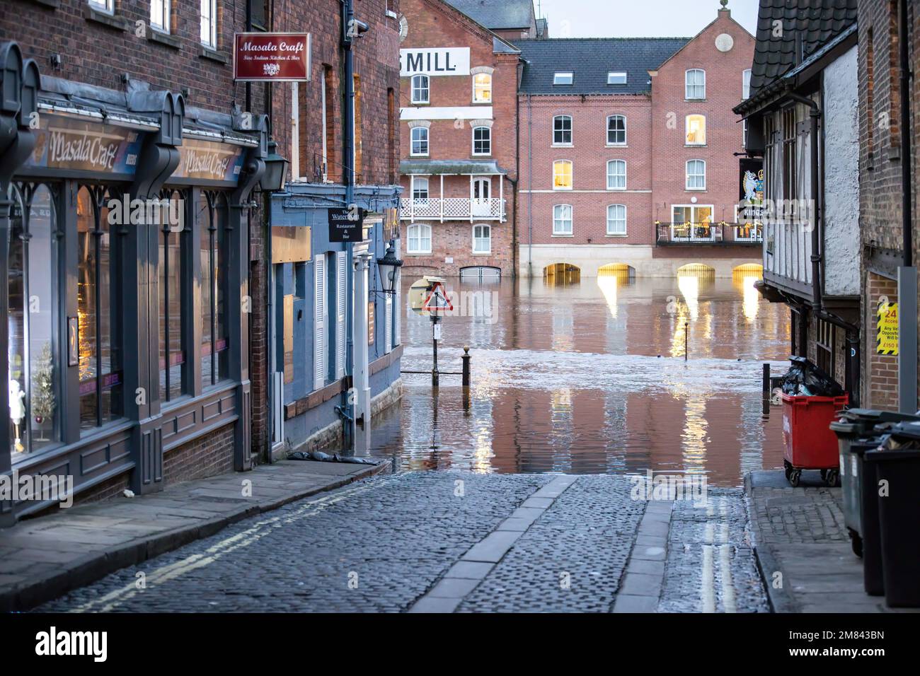 Local business are flooded as heavy rain causes the River Ouse in York ...