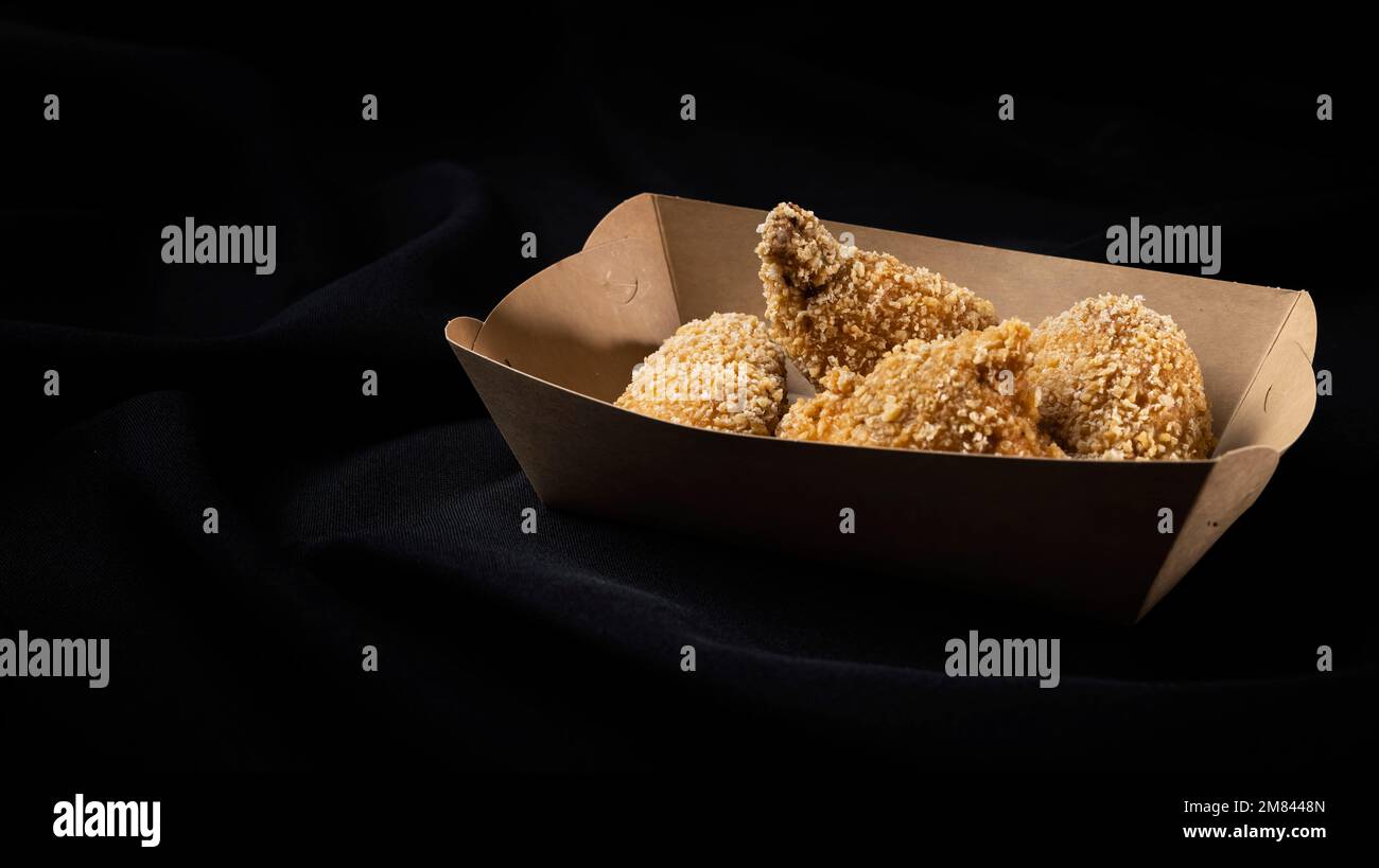 Breading chicken legs Stock Photo