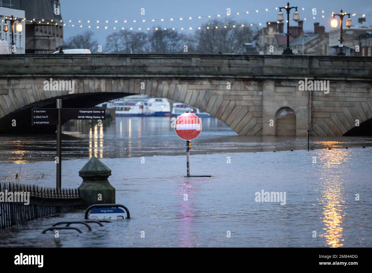 York, UK. 12th Jan, 2023. A street traffic sign is submerged in heavy ...
