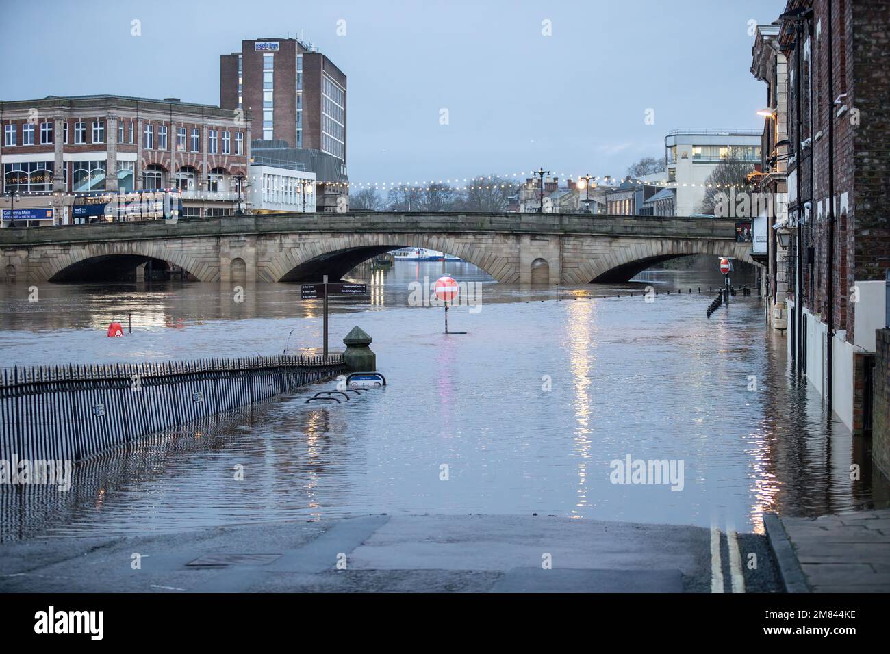 York, UK. 12th Jan, 2023. A street traffic sign is submerged in heavy ...