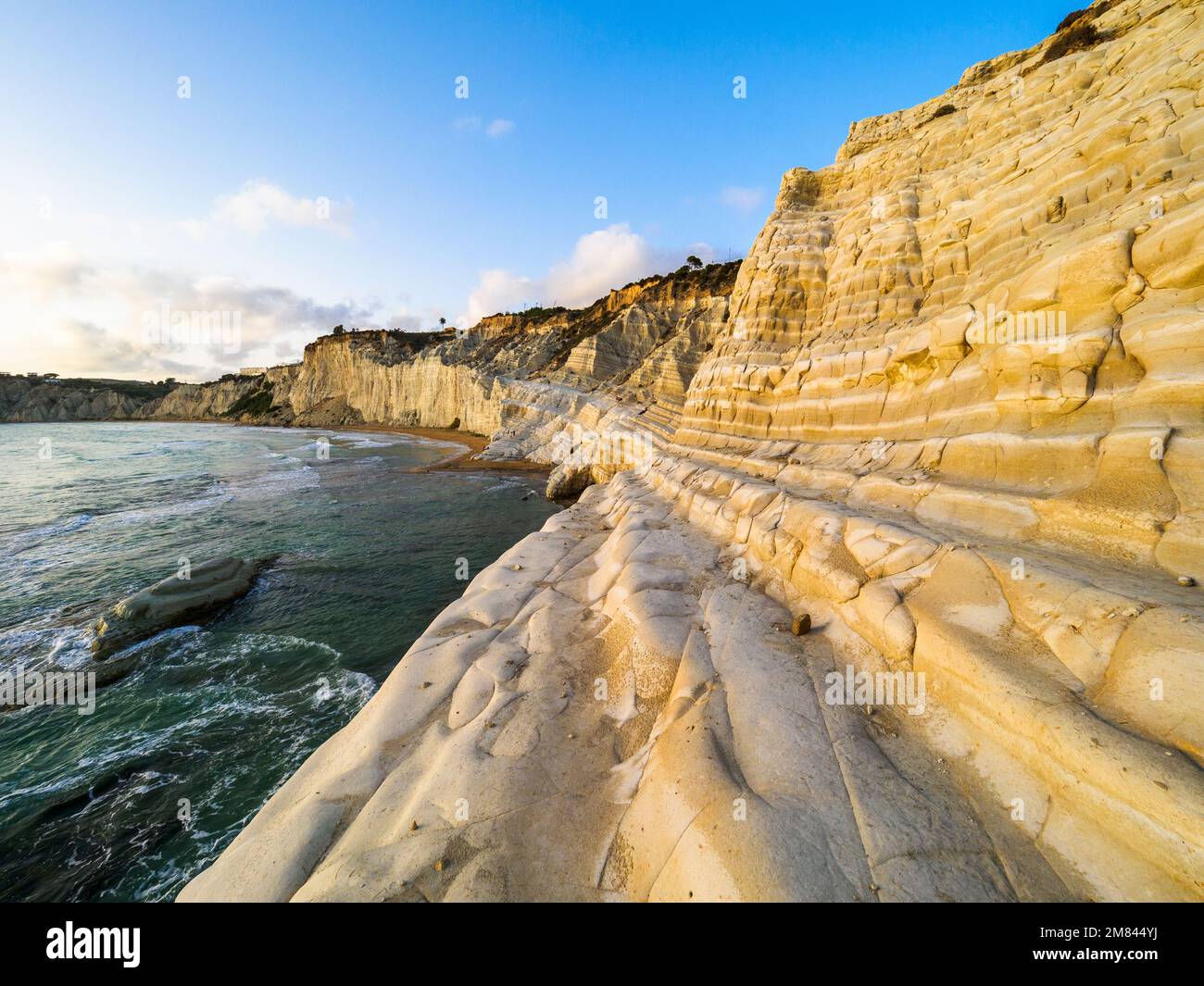 The Scala dei Turchi (Stair of the Turks) is a rocky cliff on the coast of Realmonte formed by marl, a sedimentary rock with a characteristic white color, formed from the tests of planktonic foraminifera. Agrigento, Sicily , Italy Stock Photo