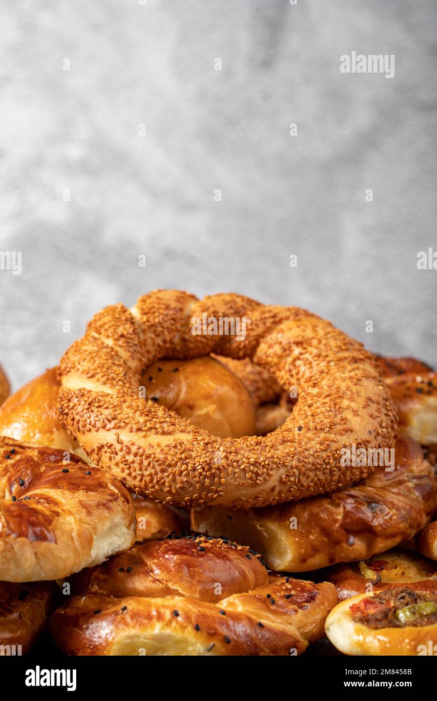Bagel and pogaca varieties. They eat pastries in piles. Bakery products