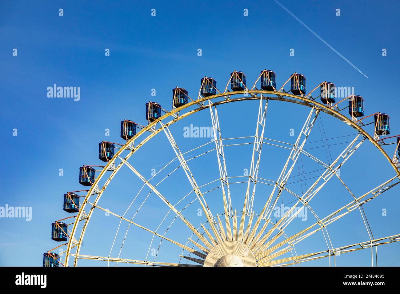 Ferris wheel in Stuttgart city under blue sky Stock Photo