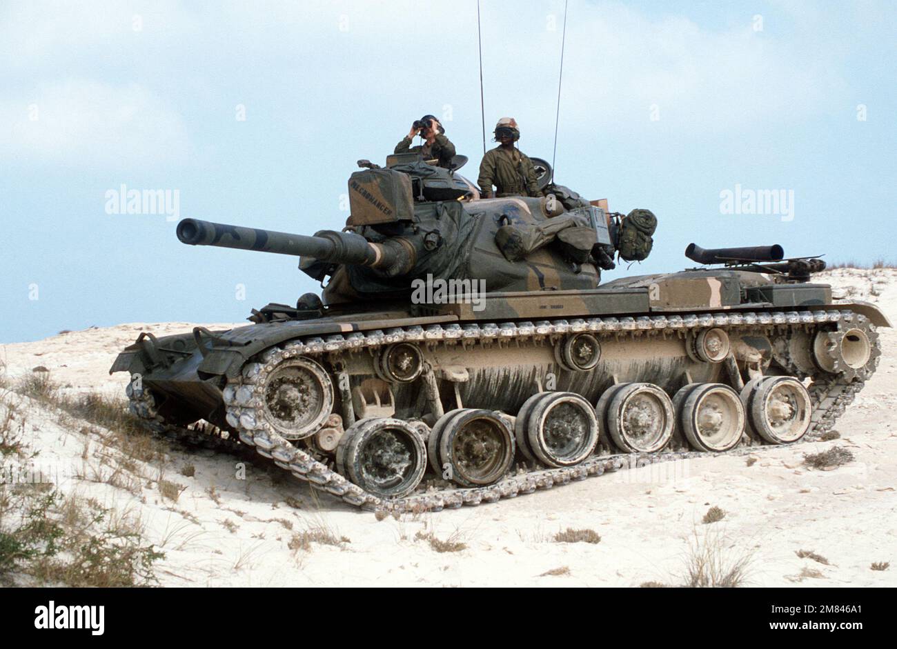 An M-60 main battle tank takes up a position on the beach during an ...