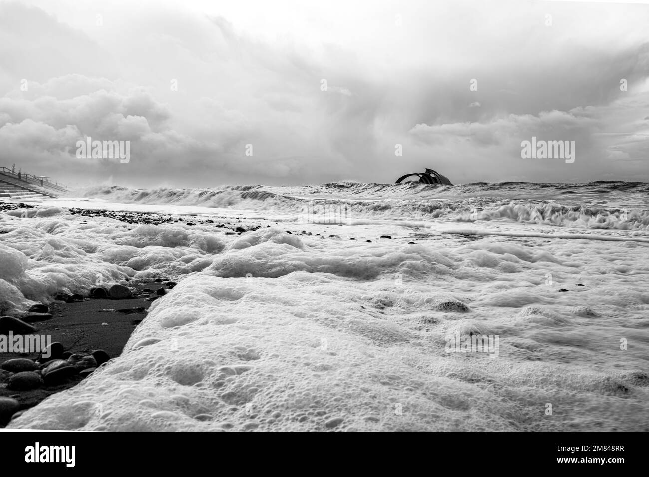 Strong winds whip up the surf near Mary's Shell at Cleveleys, near Blackpool, Lancashire, on December 10 2022. Stock Photo