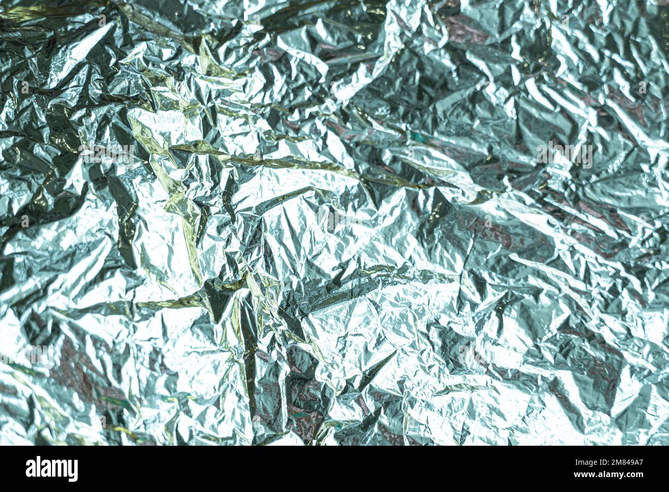 Torn crumpled metallic foil hi-res stock photography and images - Alamy