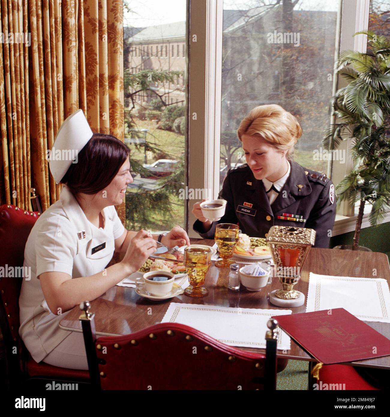 A U.S. Army nurse converse over a meal. Country Unknown Stock Photo Alamy