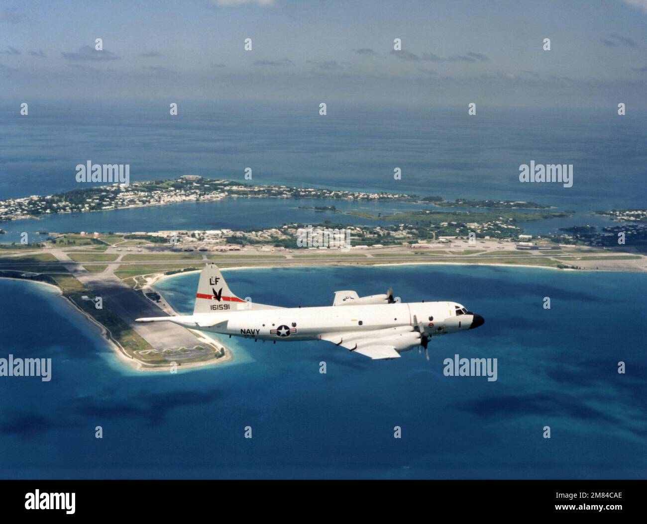 An air-to-air right side view of a P-3 Orion aircraft from Patrol Squadron 16 (VP-16) returning from an anti-submarine tracking mission. The squadron, based in Jacksonville, Florida, is deployed to Naval Air Station, Bermuda. Country: Bermuda (BMU) Stock Photo