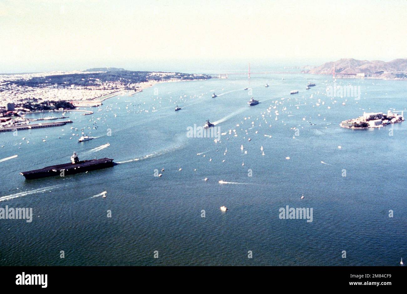 Navy ships led by the nuclear powered aircraft carrier USS ENTERPRISE (CVN 65), enter the bay for San Francisco's Fleetweek celebration. Base: San Francisco State: California (CA) Country: United States Of America (USA) Stock Photo