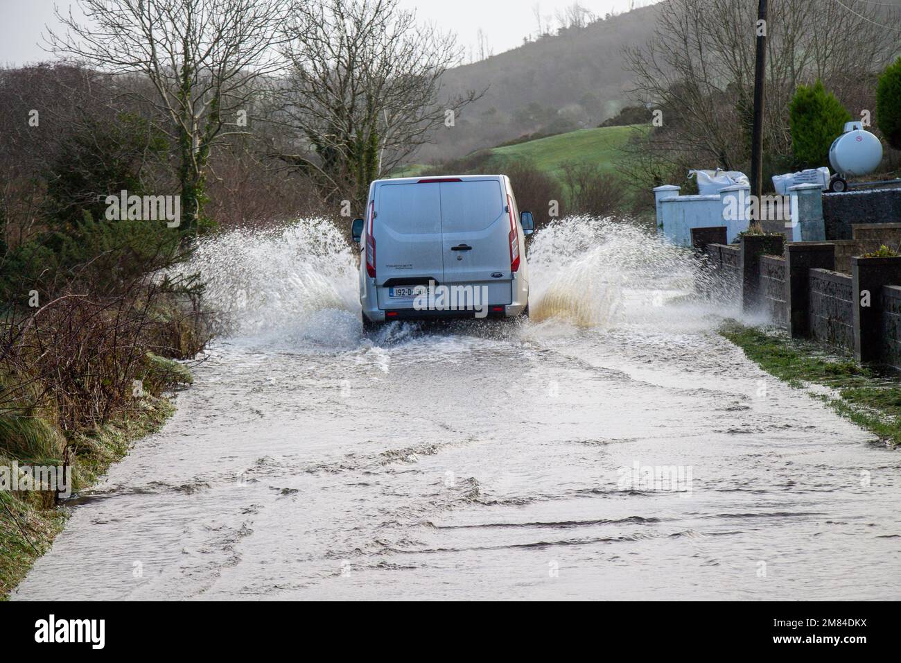 Road covered in winter flood waters Stock Photo