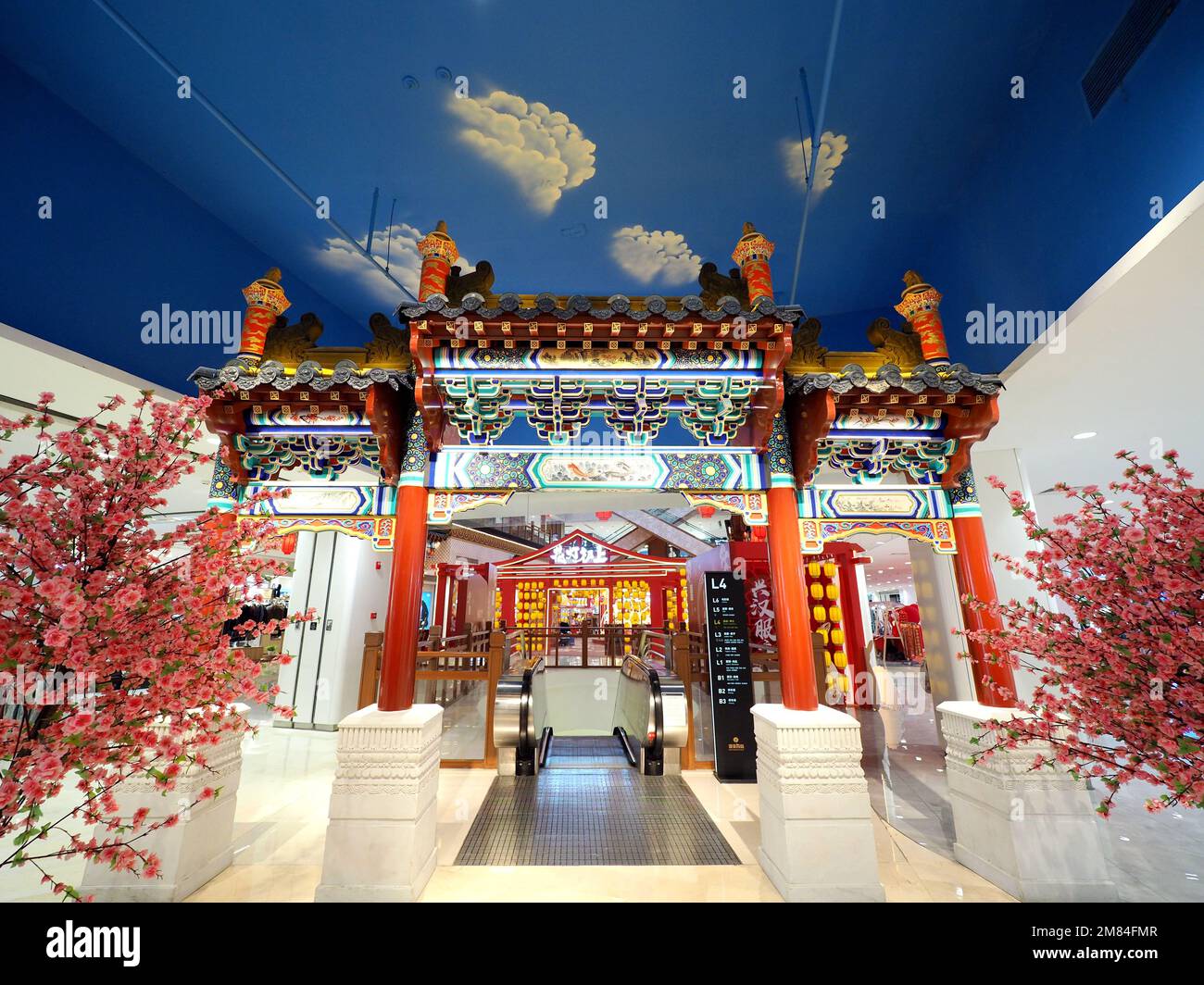 BEIJING, CHINA - JANUARY 12, 2023 - People pose for photos at the Chinese New Year 'Jade Rabbit' at the Intime Department store in Beijing, China, Jan Stock Photo