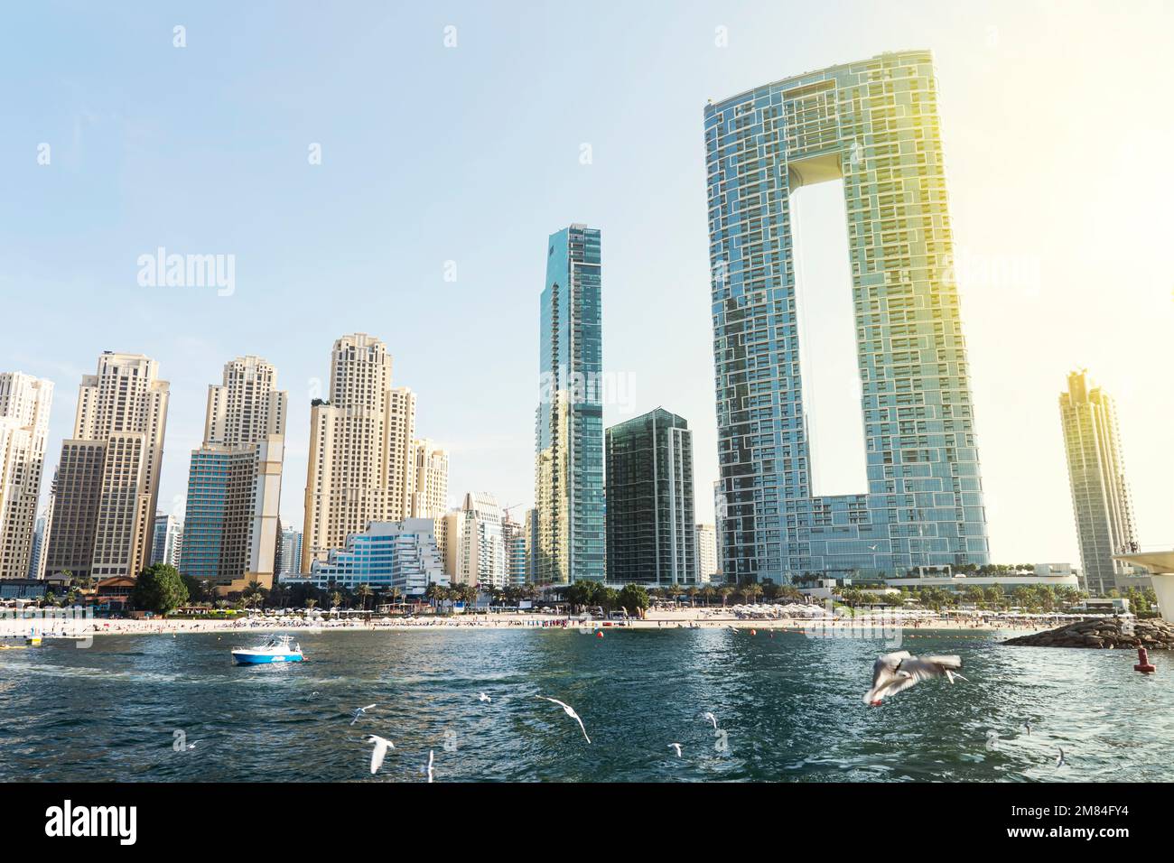 beautiful sunrise over dubai marina. skyscrapers and city beach of dubai united arab emirates Stock Photo