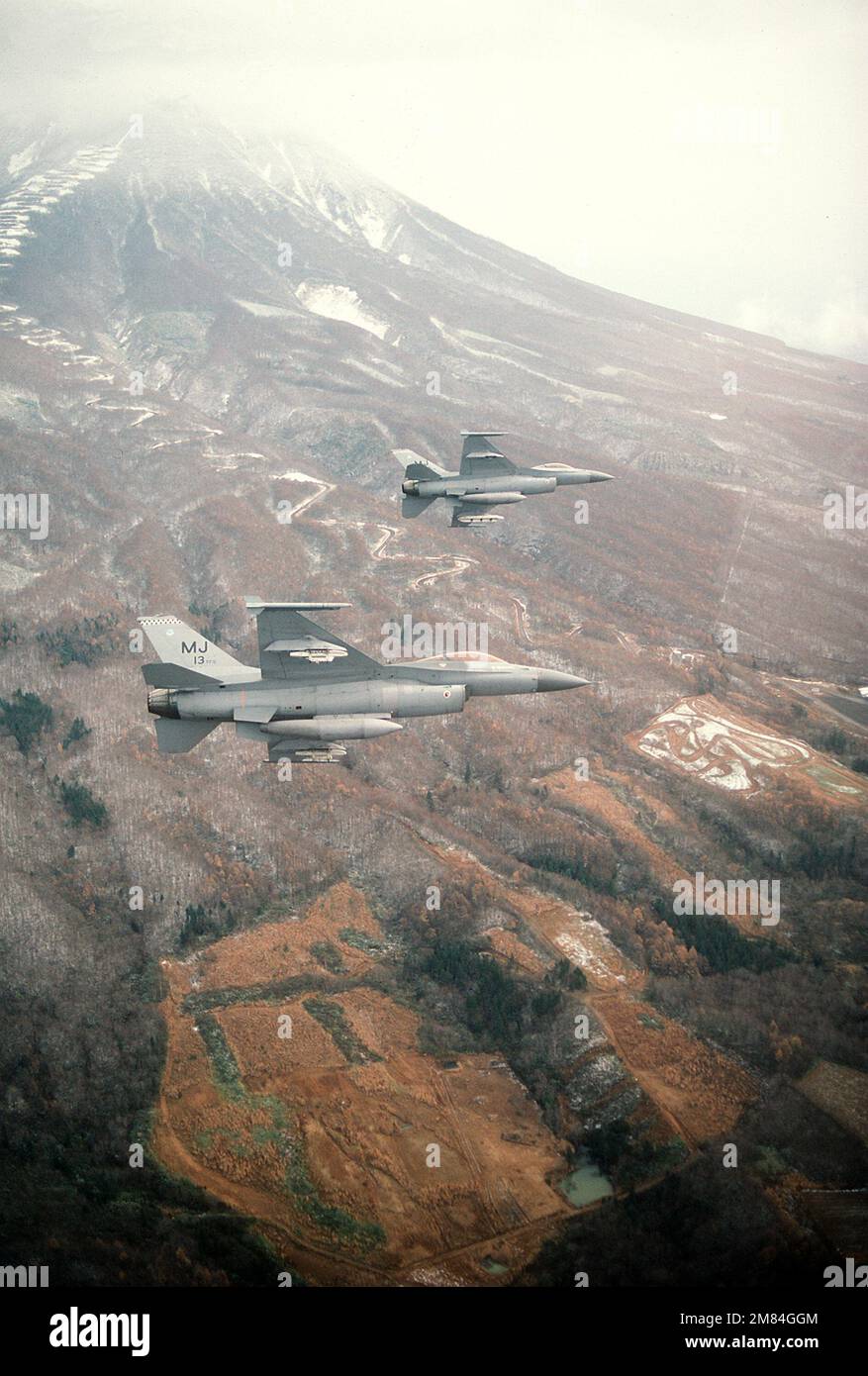 Two 13th Tactical Fighter Squadron F-16A Fighting Falcon aircraft bank ...