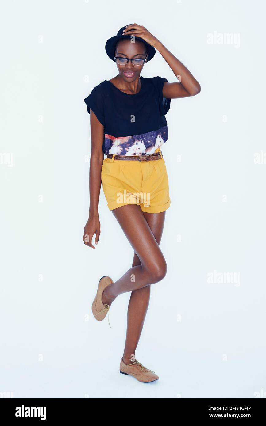 Her style is unique and all her own. A statuesque african american woman modeling the latest in trendsetting clothing. Stock Photo