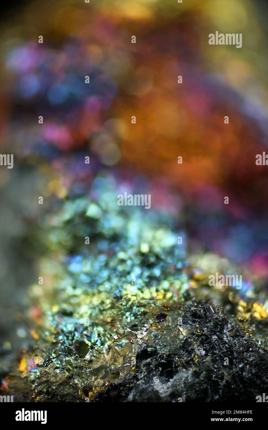 Microscope image of colorful copper ore. This is copper sulphide called