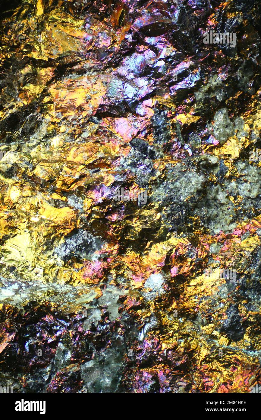 Microscope image of colorful copper ore. This is copper sulphide called