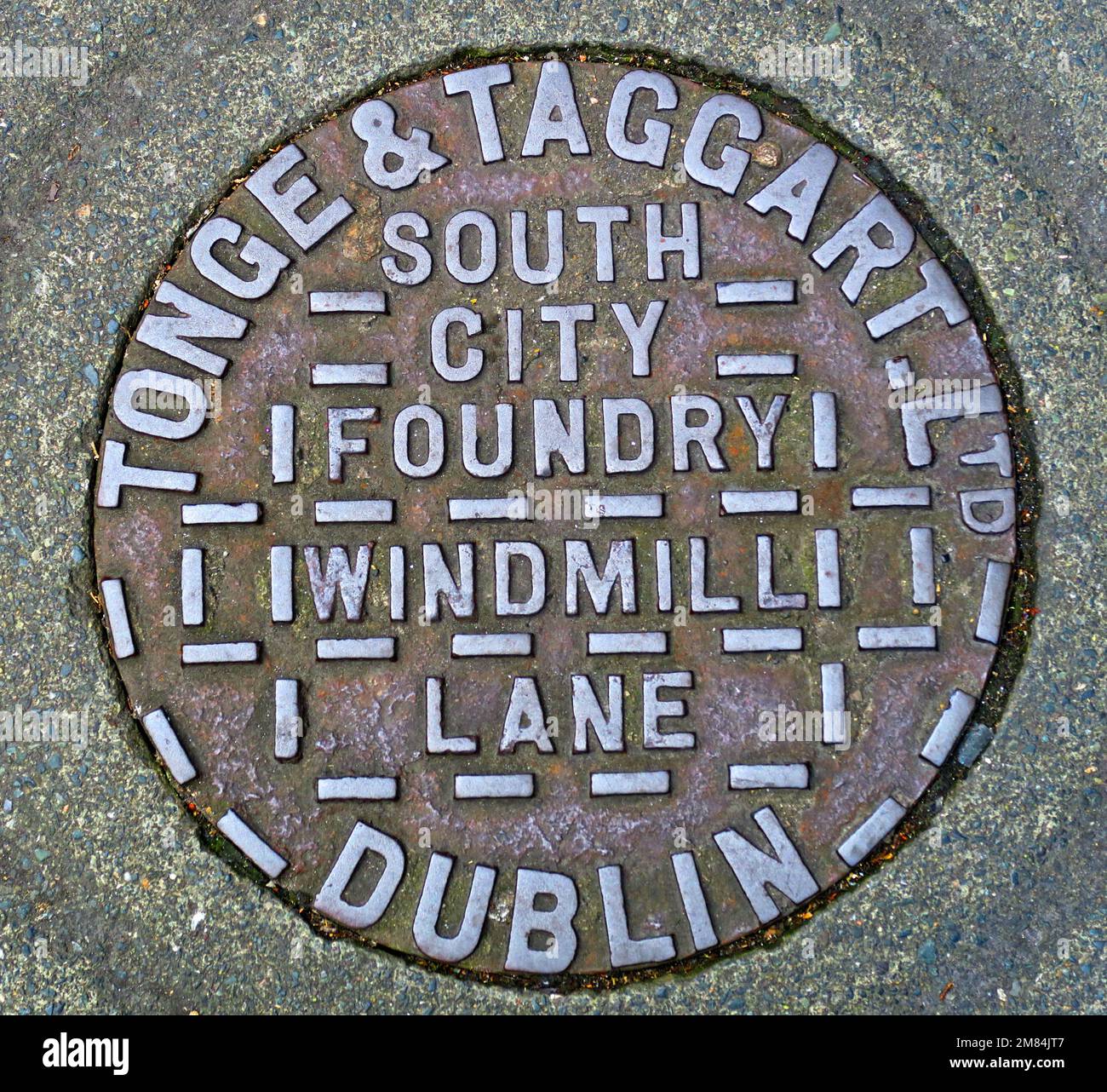 Cast iron Grid embossed with Windmill Lane, Dublin, Tonge & Taggart, South City Foundry, Eire, Ireland Stock Photo
