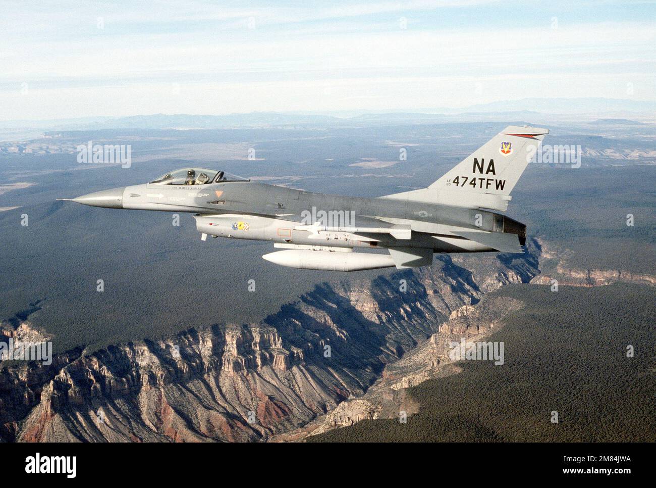 An air-to-air left side view of a 474th Tactical Fighter Wing (474th ...