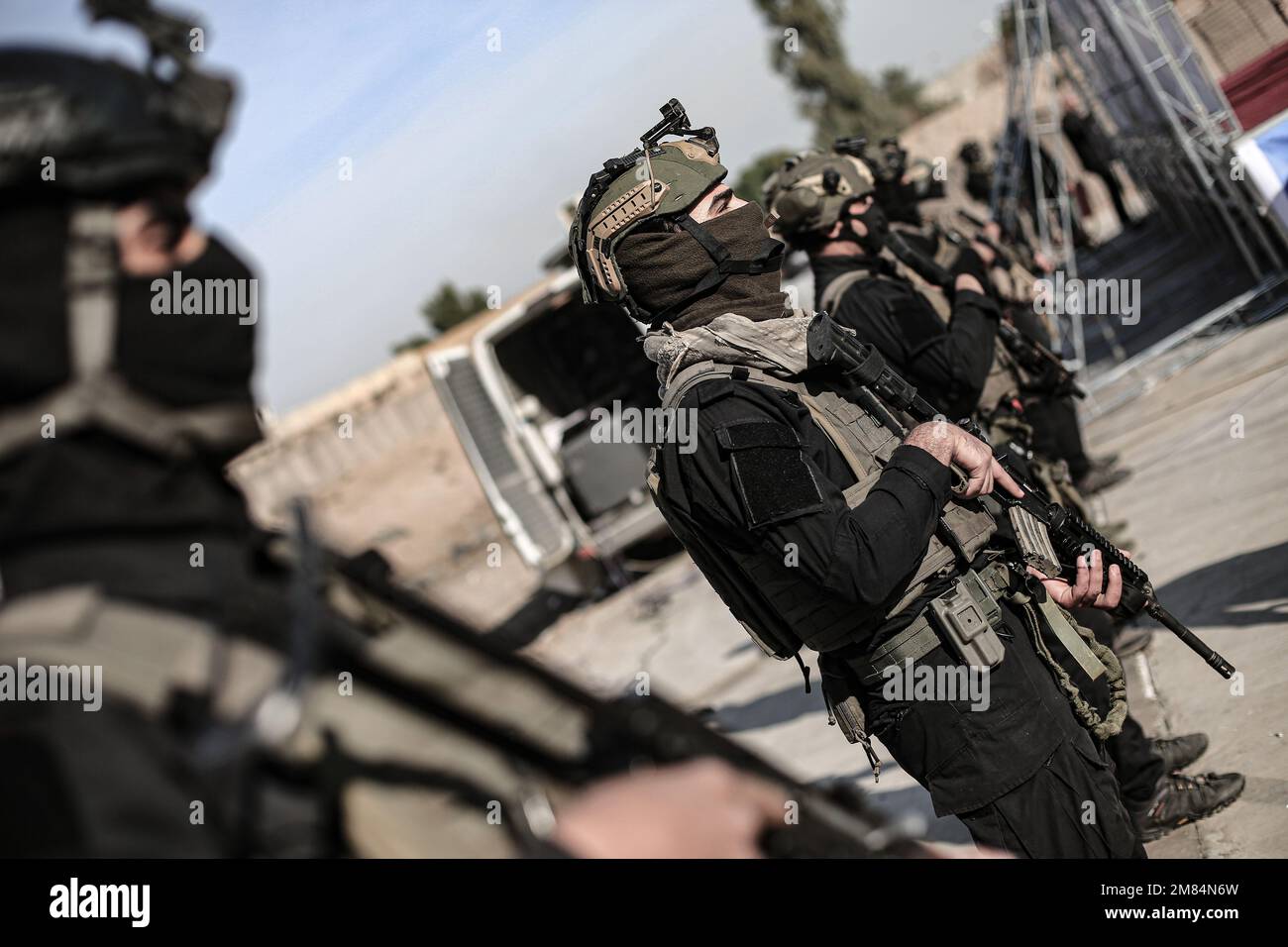 Baghdad, Iraq. 12th Jan, 2023. Security forces stand guard during a press conference held by the Popular Mobilization Forces (PMF) to display seized weapons belonging to the Islamic State (IS). Security Chief of Iraq's Popular Mobilization Forces (PMF), Abu Zainab al-Lami announced during a press conference that the forces carried out a military operation in Salah al-Din and Diyala provinces to seize various weapons such as Mortar shells, machine guns, explosives, grenades, and other logistical materials. Credit: Ameer Al Mohammedawi/dpa/Alamy Live News Stock Photo
