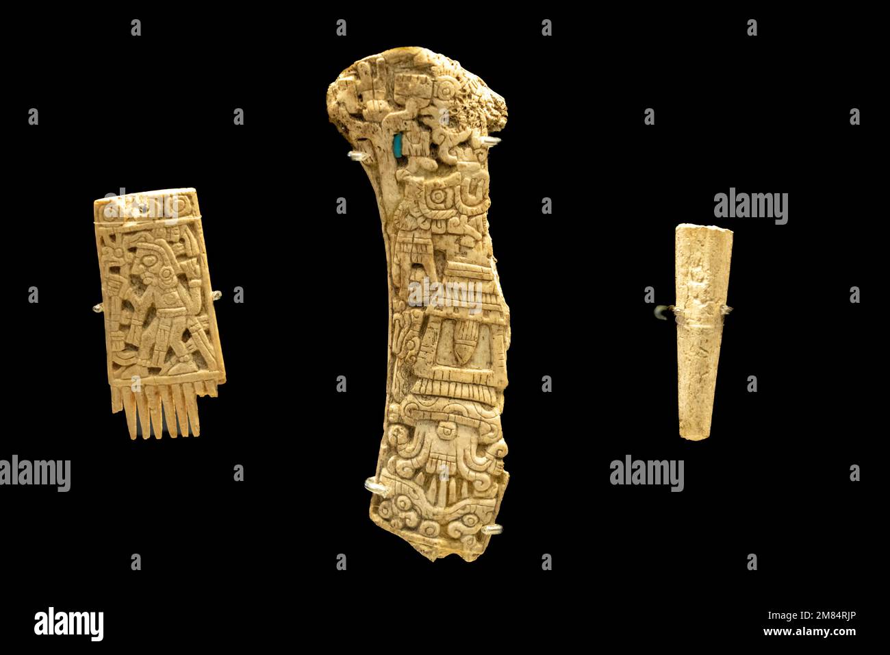 Bone with carved figures used for ritual purposes. Museum of Cultures of Oaxaca, Oaxaca, Mexico