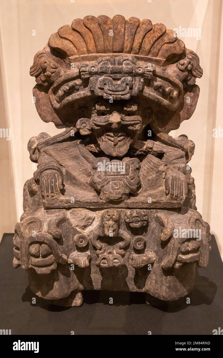 Pre-Hispanic ceramic Zapotec funerary effigy-urn of Cocijo, the god of rain, in the Museum of Oaxacan Culture, Oaxaca, Mexico.  Origin:  Monte Alban, Stock Photo