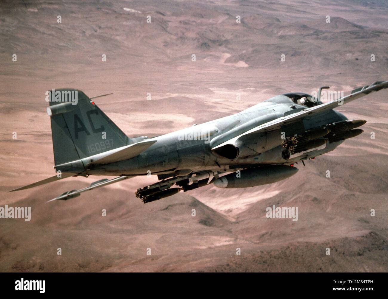 An A6E Intruder aircraft from Attack Squadron 75 (VA75) passes over a