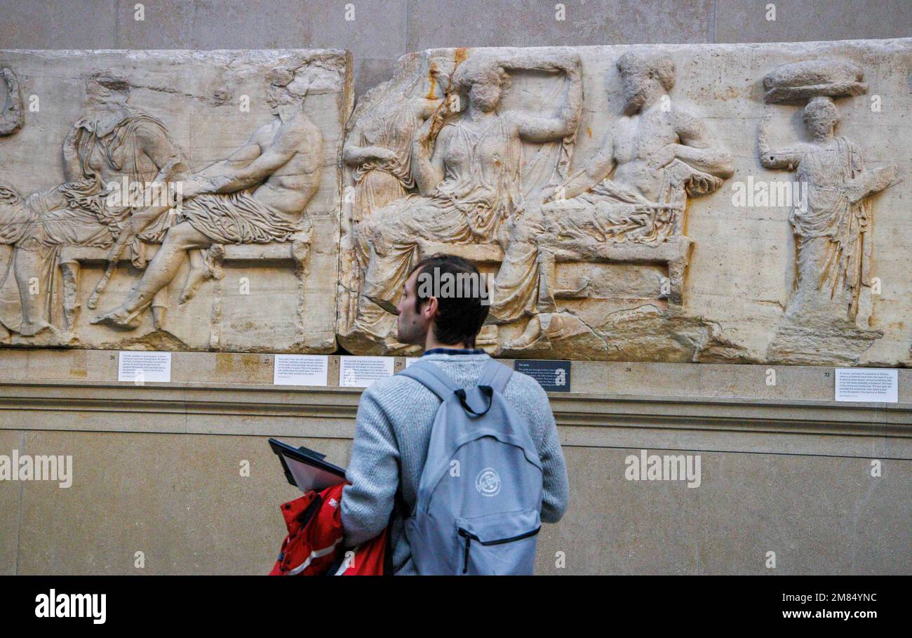 London, UK 12 Jan 2023 Visitors looking at exhibits from the Parthenon in the Parthenon Galleries at the British Museum. George Osborne - former UK chancellor and now chair of trustees at the British Museum - is reported to have negotiated the repatriation of the 2,500-year-old Parthenon marbles to Athens. The deal, struck with the Greek prime minister, Kyriakos Mitsotakis, is not yet finalised. But it is thought that the sculptures will leave London sooner rather than later and it is planned that the British Museum will receive some ancient artefacts in return. Early in the 19th century, the Stock Photo