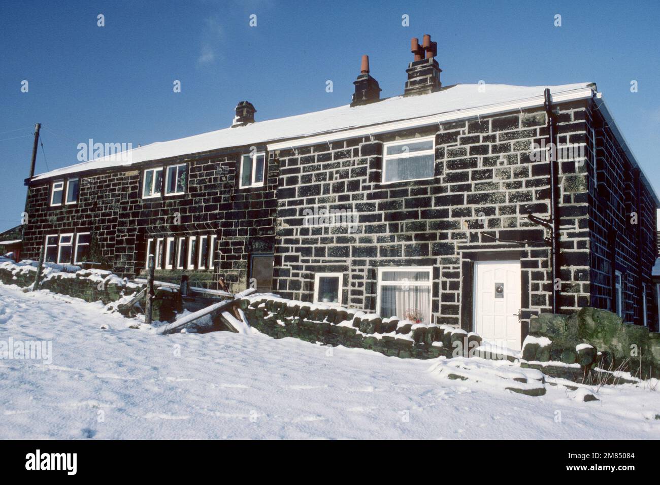 17th century farmhouse in winter in 1983, Luddenden Foot, West Yorkshire Stock Photo